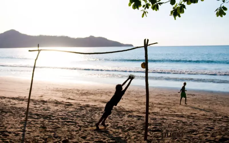 Costa-Rica-Happiest-country-kids-playing-soccer-on-beach-Pucci-Howler
