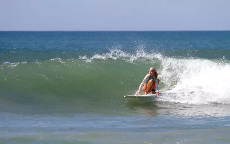woman surfer playa tamarindo beach costa rica